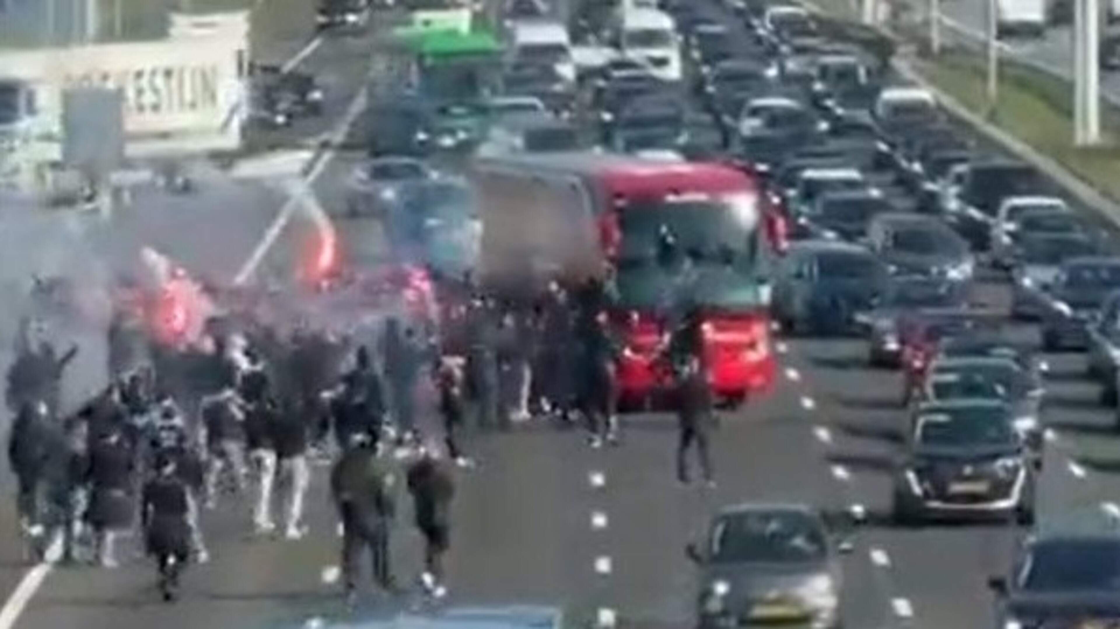 Ajax bus briefly stopped by group with flares on A4 near Hoofddorp