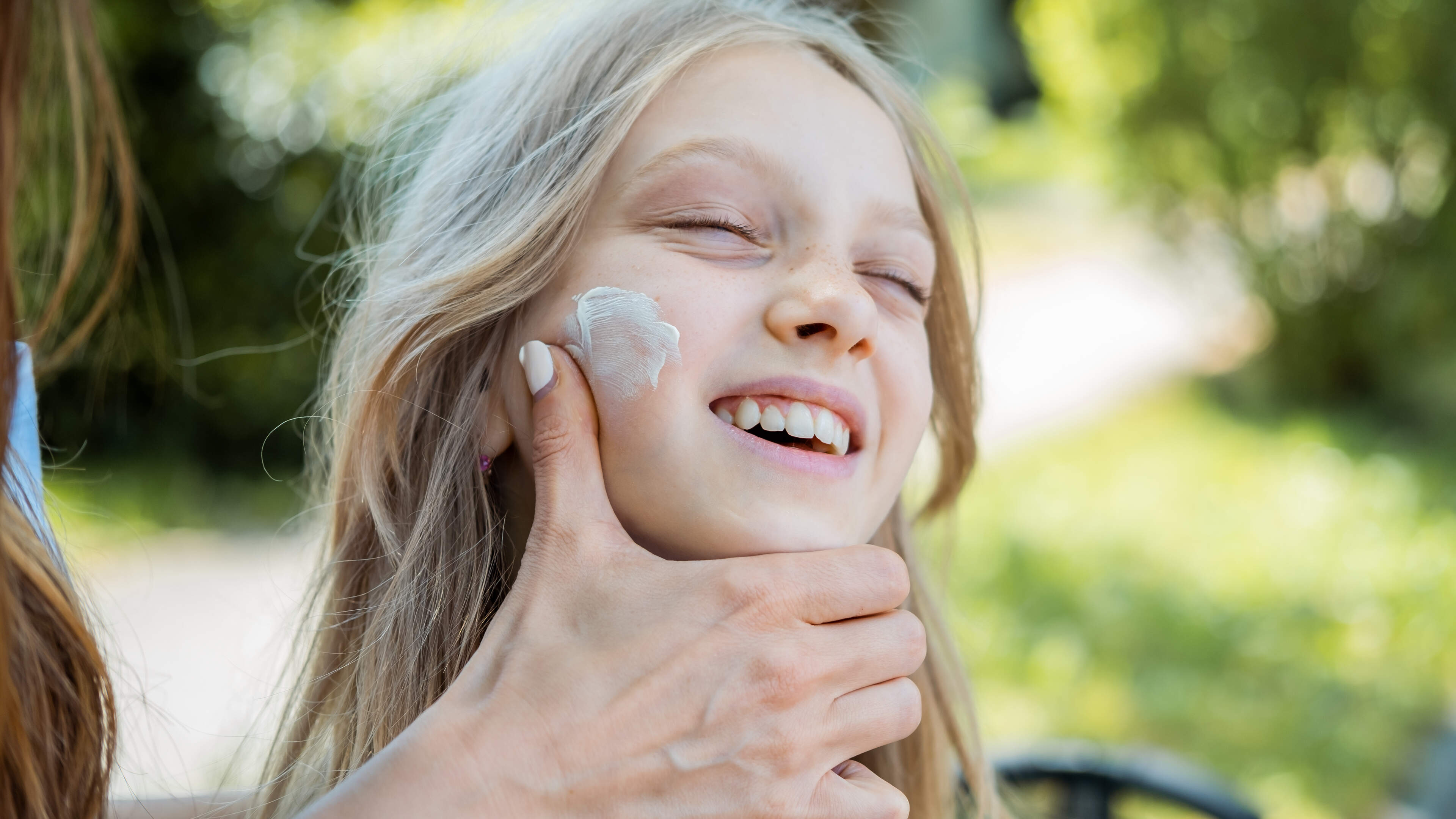 Who protects children from the sun at school and daycare? 'Should teachers also have to apply sunscreen to 36 kids?'