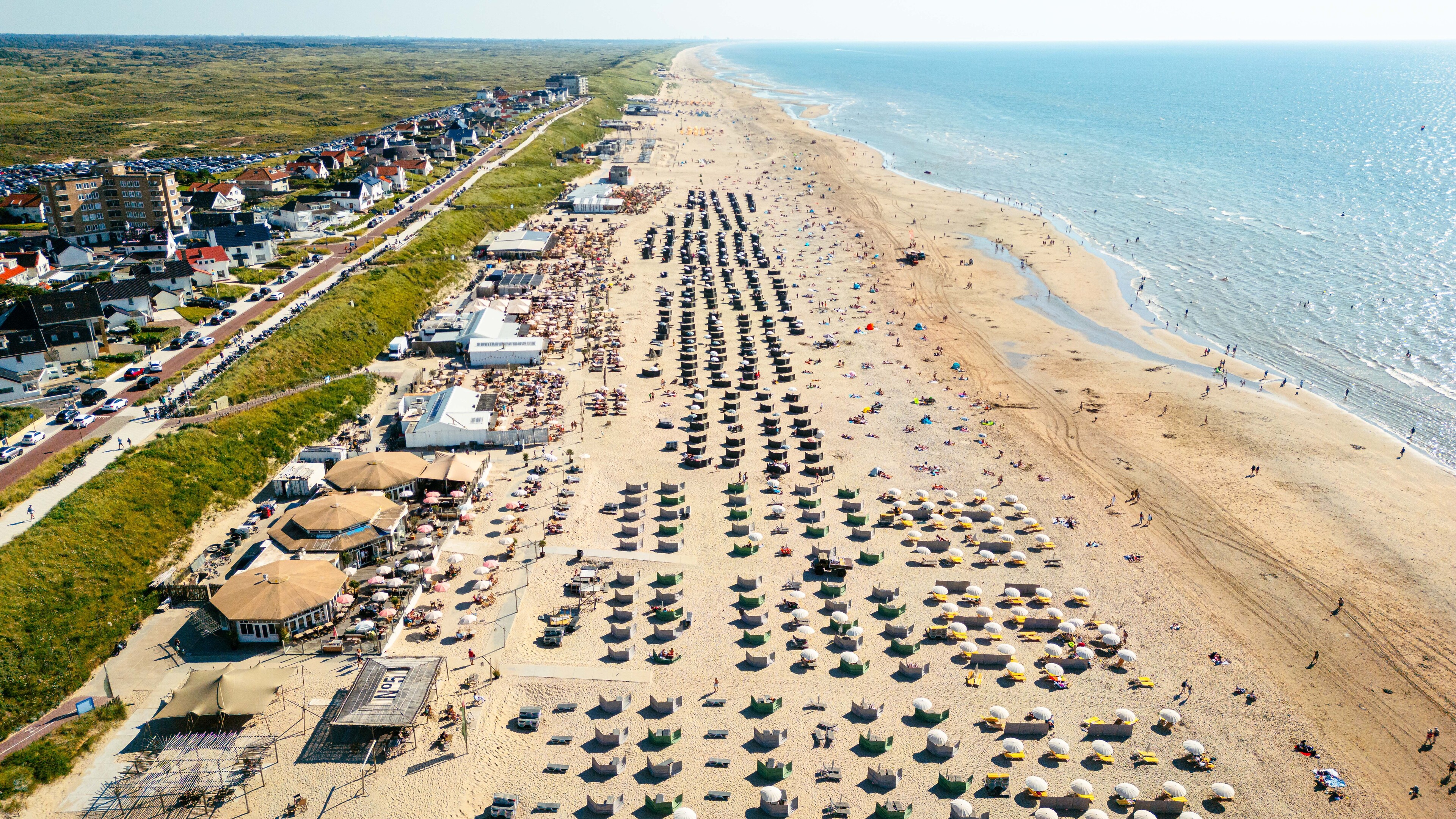 First local tropical day, beach parking lots full
