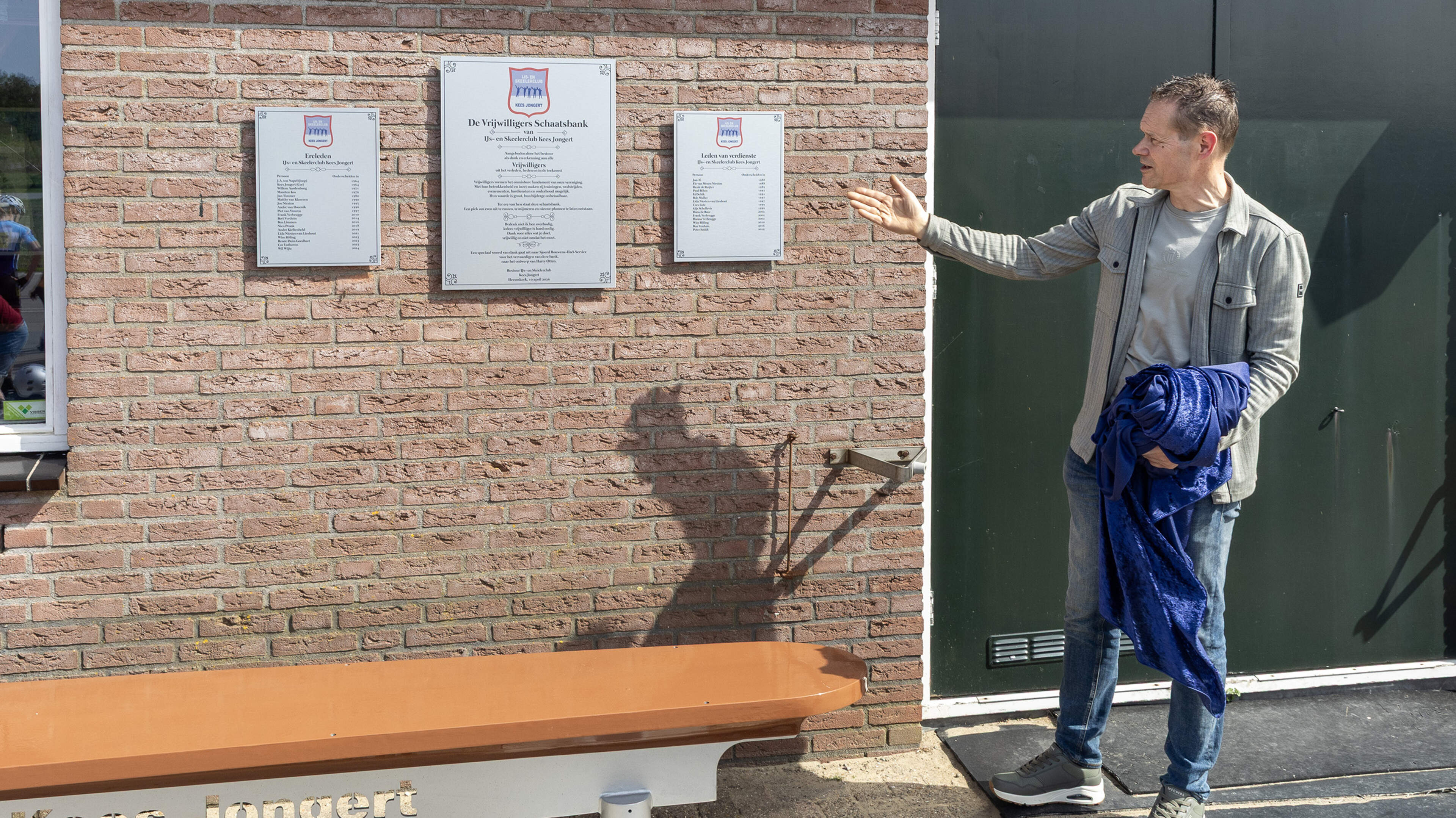 Skating bench and plaques at Kees Jongert Ice Club honor unsung heroes. Turns named after board members who completed the 'Tour of Tours'