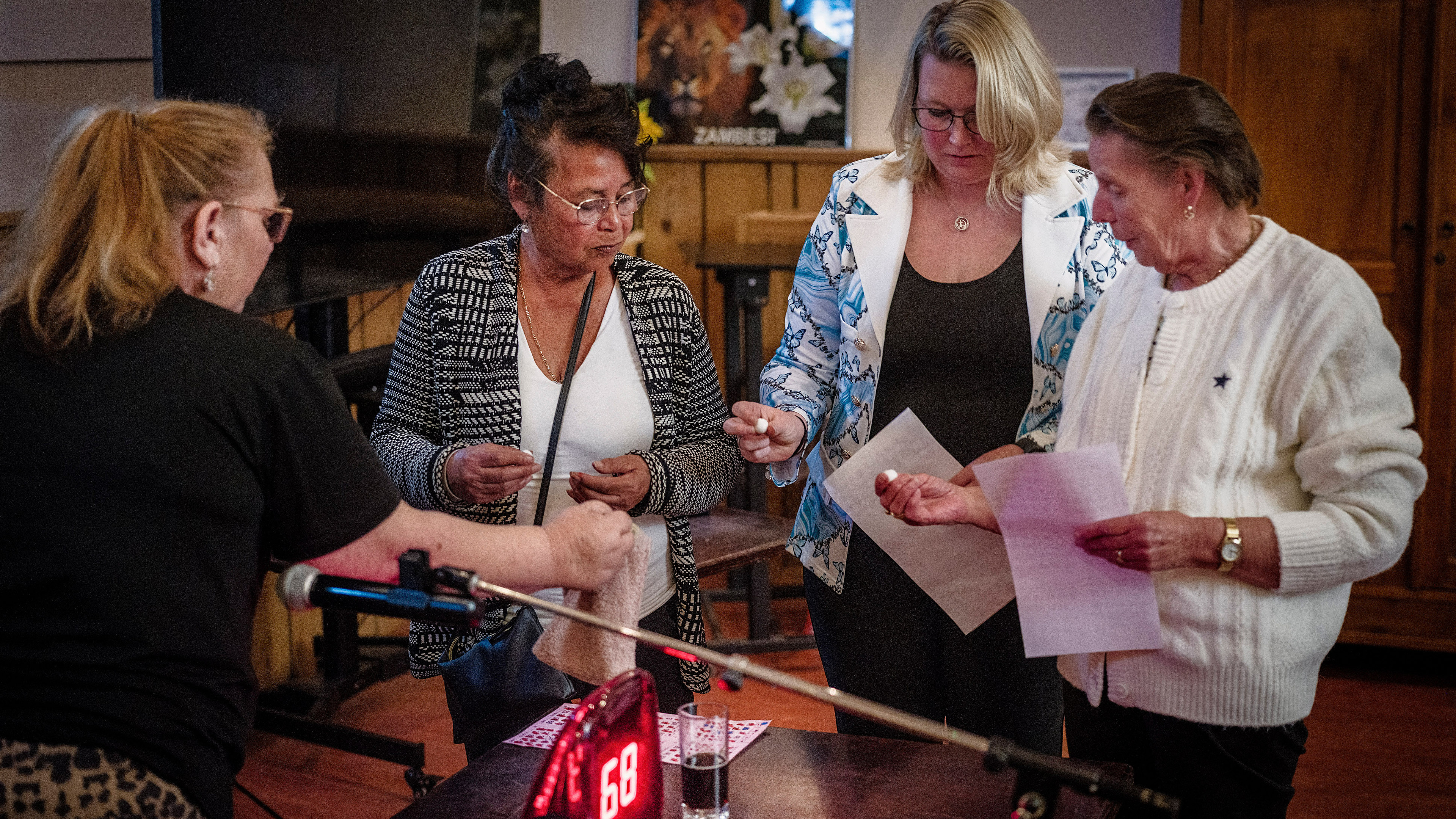 G53 G53… O64 O64… B18 B18… N40 N40 BINGO! Applause erupts in the village hall