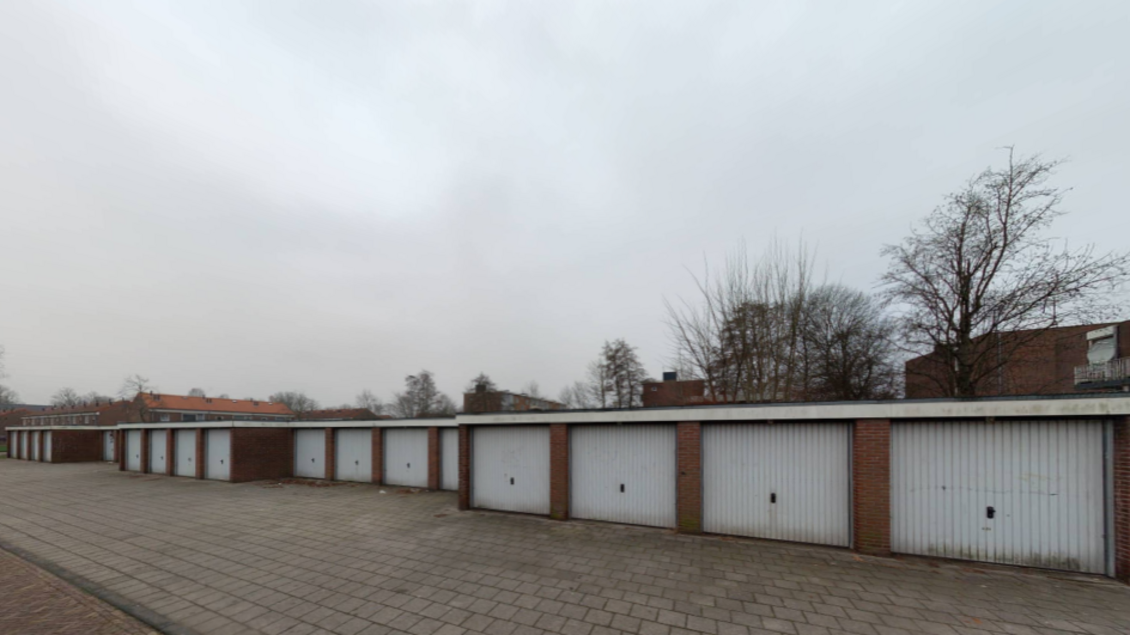 Plan for temporary housing on Huibert Pootstraat. Garages to make way for 63 units.